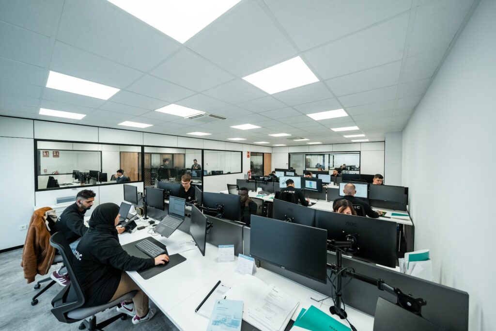 Office workers are busy working on computers.